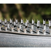 Feeder with Shark Teeth strips on legs and lid to deter hogs raccoons and large birds